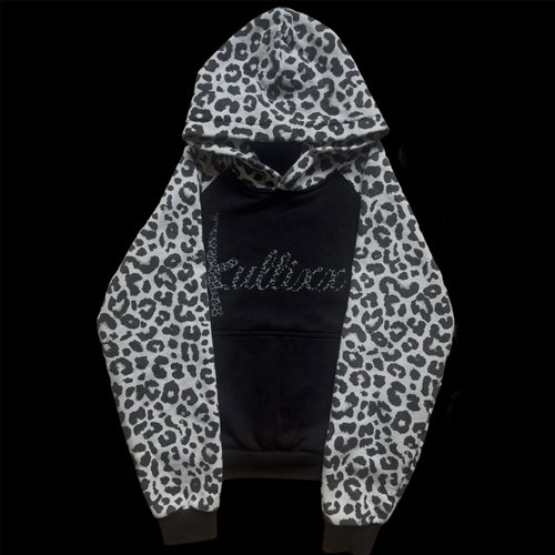Black hoodie with white leopard print sleeves on a black background