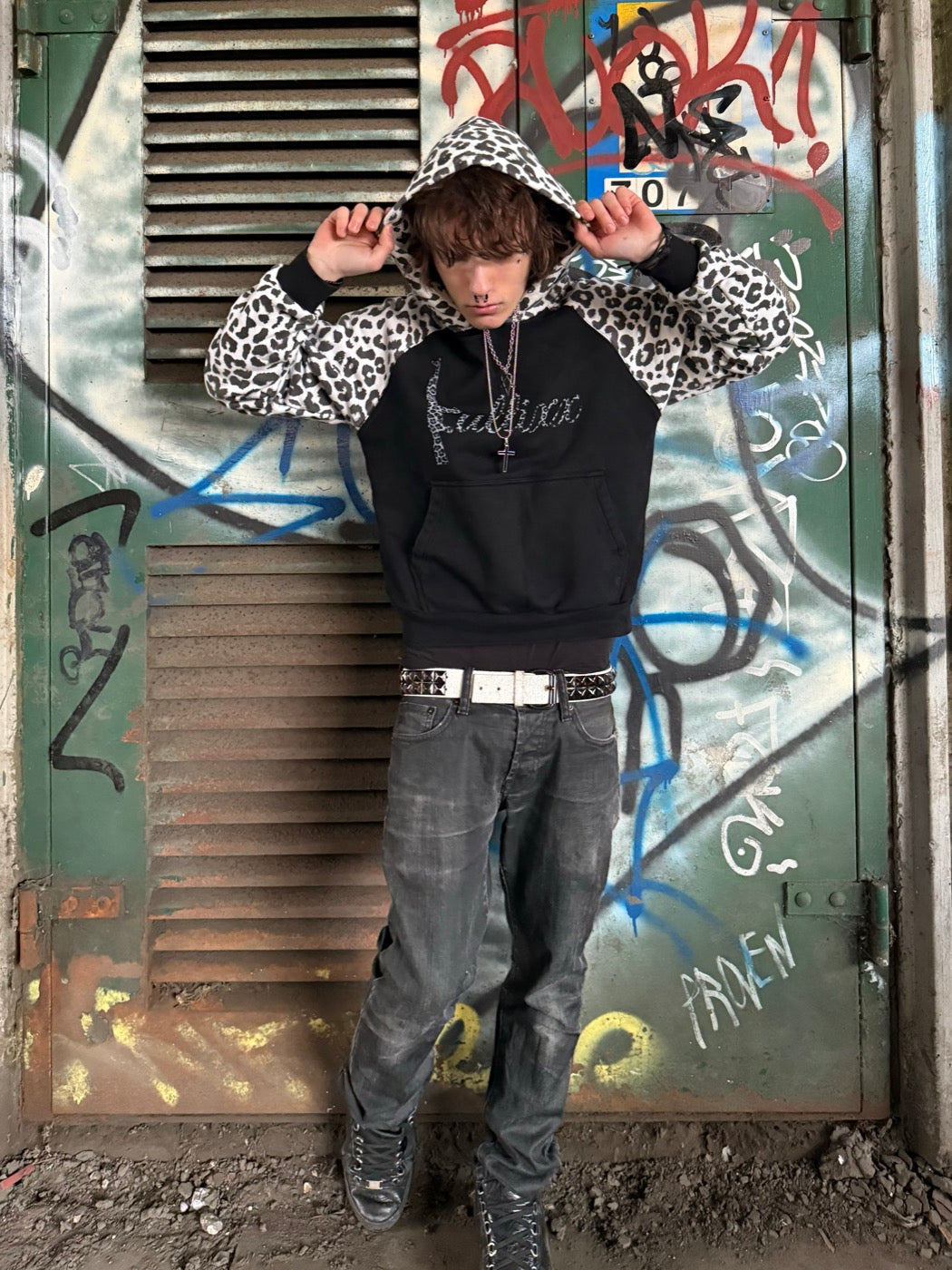 Model wearing the Snow Leopard Hoodie, hood up, leopard hood and sleeves