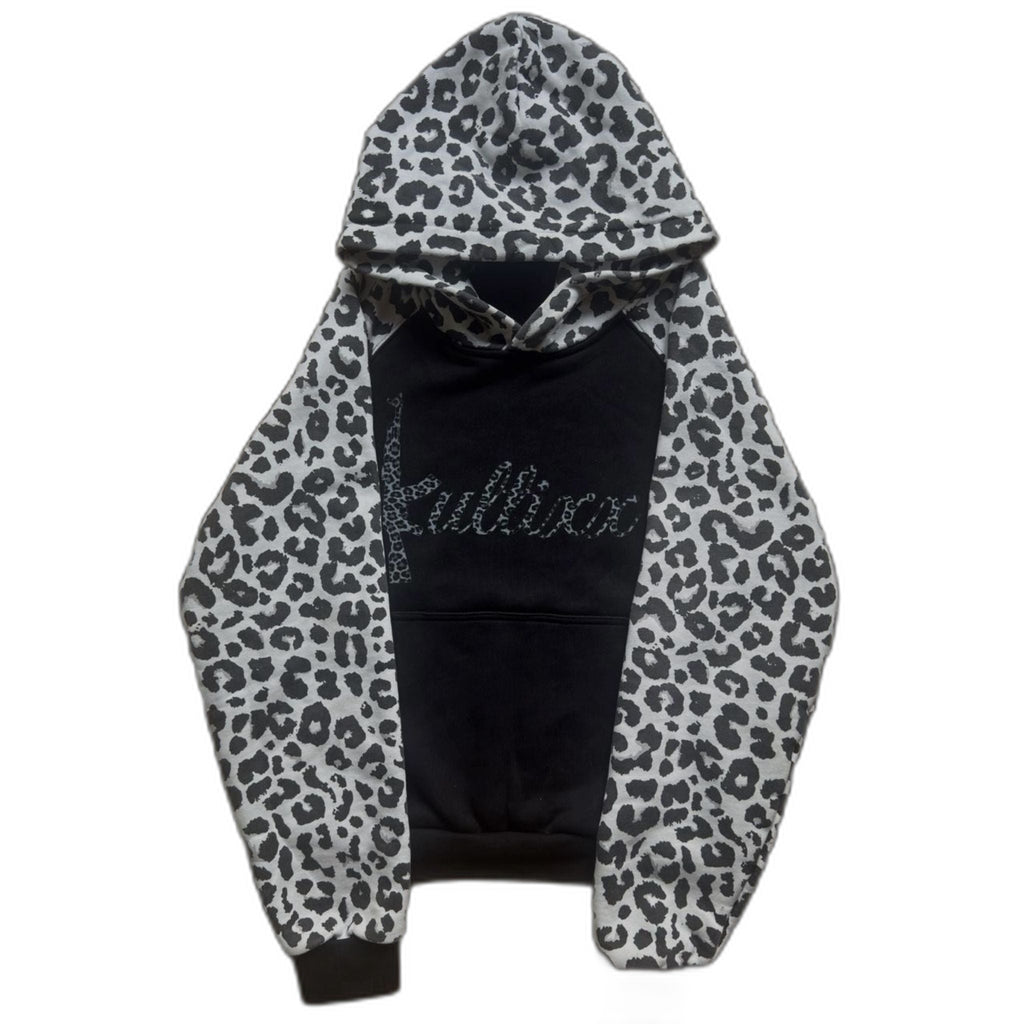 Black hoodie with white leopard print sleeves on a white background